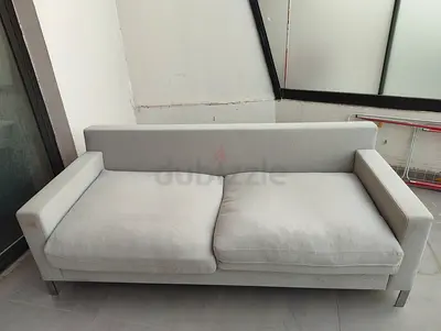Light grey 2-seater sofa - modern design, good condition
