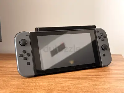 Nintendo Switch console (grey Joy-Con) in perfect condition with dock