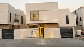 * **Option 1 (Direct and Attractive):** Luxurious modern villa with 5 master bedrooms in Al-Haliyo 2