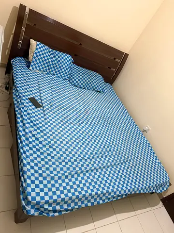 King size wooden bed frame with mattress and headboard