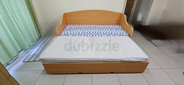 Single bed with pull-out drawer and mattress - light wood