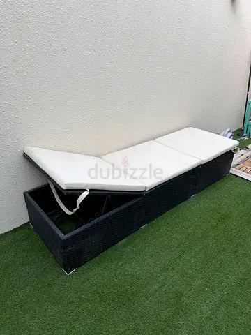 Black and cream rattan sun lounger