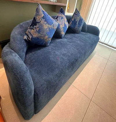 Blue three-seater sofa in excellent condition