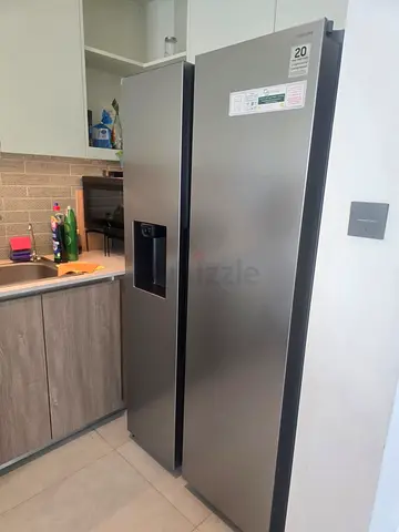 Samsung Side-by-side stainless steel with water dispenser/ice maker/Crush direct plumb with warranty