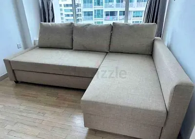 Light grey L-shaped sofa with storage — good condition