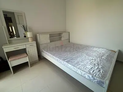 White wooden double bed with mattress and matching dressing table