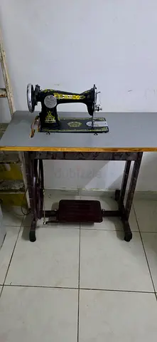 foot-pedal sewing machine with wooden table