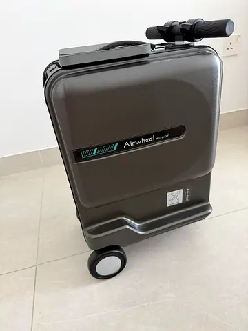 Hard case with wheels for carry-on luggage with electric drive - in good condition.