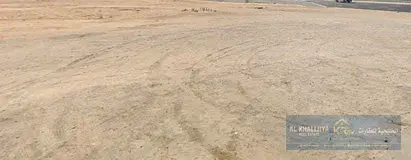 Residential/commercial land for sale in Al Amrah area, on a street and alley. The plot measures 20,6