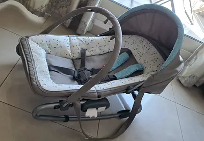 Gently used baby rocker/bassinet with canopy and harness