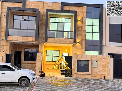 Townhouse for sale in Al Helio 2, Ajman, 5 master bedrooms with a majlis and living room, at a special price including fees and ownership.