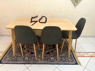 Wooden dining table with three grey chairs and bench - good condition