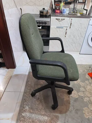 Used Green Fabric Office Chair with Armrests and Wheels