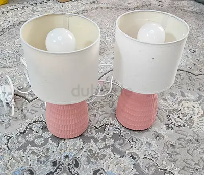 Pair of pink ceramic table lamps with white shades