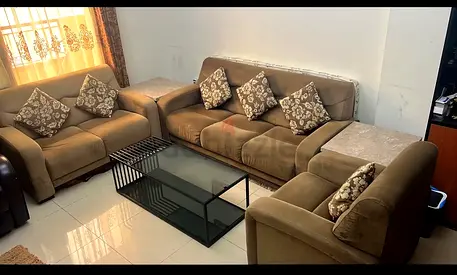 3-piece brown fabric sofa set with glass coffee table — good condition