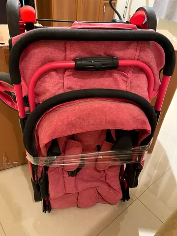 Lightweight foldable pink stroller - good condition