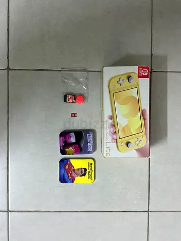 Yellow Nintendo Switch Lite console + 2 game cards (used)