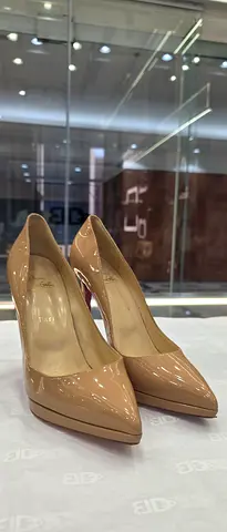 Beige patent leather high heel pumps - size unknown, gently used