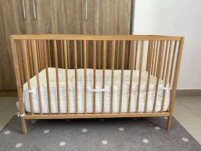 Ikea cot with Skonast foam mattress, bumper pad and fitted sheet