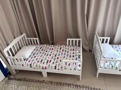 IKEA Kura-style toddler beds (2) — white wooden low beds, good condition