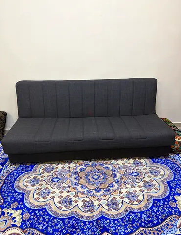 Dark grey fabric sofa bed - compact 3-seater