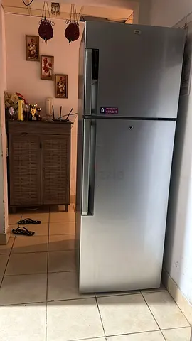 Silver double-door refrigerator - good working condition