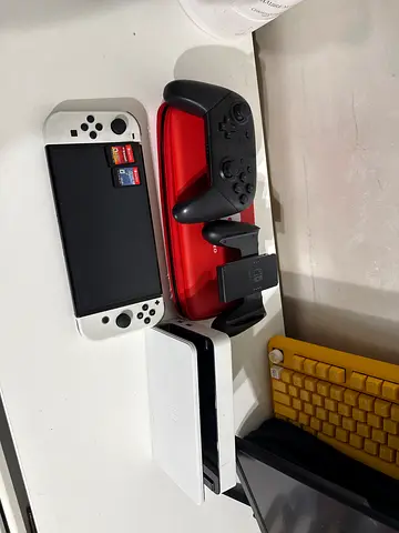 Nintendo Switch OLED with Dock + Pro Controller and Grip and two games- White