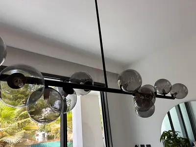 Modern bubble glass chandelier - black metal linear pendant from Chattels & More. New, it cost 1600