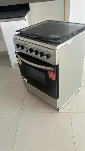 Used freestanding gas oven with 4-burner stovetop — good working condition