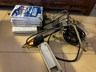 Nintendo WII with games and steering wheel