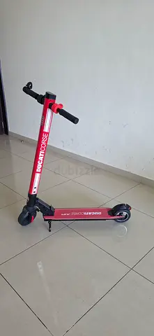 Red foldable electric scooter in good working condition