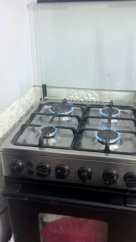 Used 4-Burner Stainless Steel Gas Stove with Oven - Good Working Condition