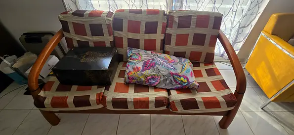 Wooden 5-seater sofa with patterned cushions — good used condition. Giveaway price