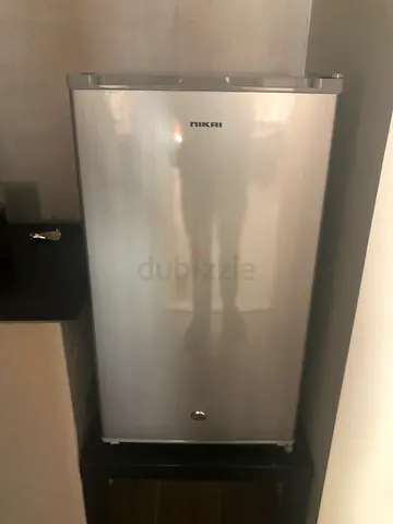 Single-door stainless Nikai mini fridge in good condition