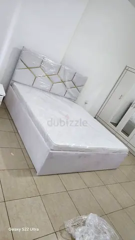 Queen size bed with upholstered headboard and mattress - like new
