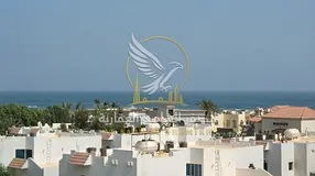 3 bedroom apartment with a living room for rent in Al Qulayaa Sharjah with a balcony and sea view ce