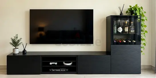 Modern IKEA BESTÅ entertainment/storage unit in black, combining a long TV bench with closed storage