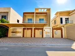 For rent, a villa in Al Yasmeen, Ajman, 5 rooms, a sitting room, a hall, a spacious kitchen, and a m