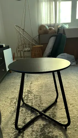 Round black metal side table with foldable legs