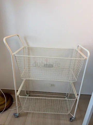 White metal rolling storage trolley with two wire baskets