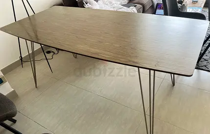 Modern rectangular dining table with wood top and metal hairpin legs