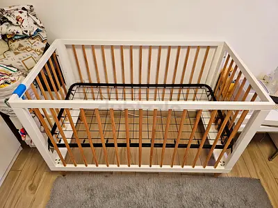 Wooden baby crib/cot in good condition, white and natural finish