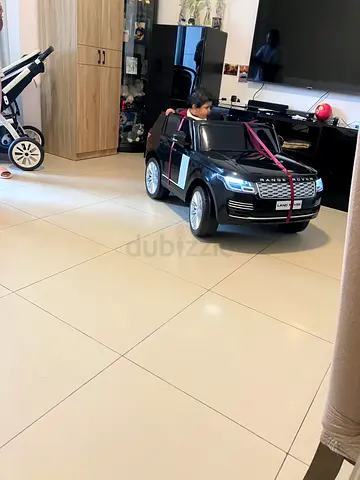 Kids Electric Ride-On Range Rover — Black, Good Condition