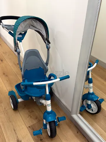 Teal toddler tricycle with push handle and canopy - good condition