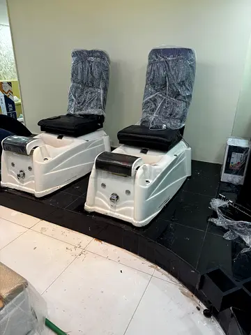 Pair of white salon pedicure chairs - used