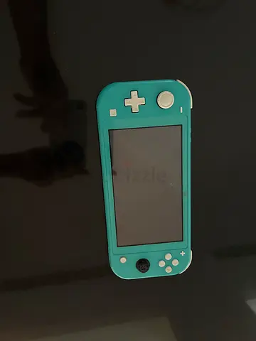 Nintendo Switch Lite Turquoise - Good Working Condition with case but without one grip pad