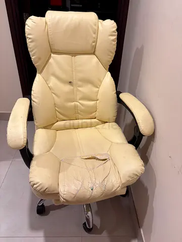 Cream leather office chair with wear — ergonomic high back