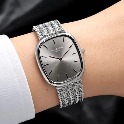 Patek Philippe silver dress watch with woven bracelet