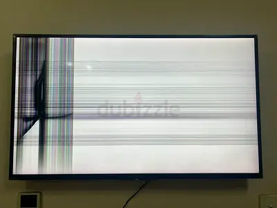 Broken 43-inch LED TV — cracked/lines on screen, for parts or repair