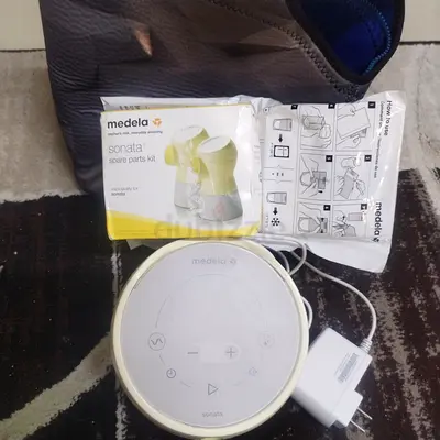 Medela Electric Breast Pump with Charger spare parts kit new- Used